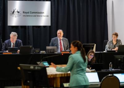 Photo of the 3 Commissioners at a hearings